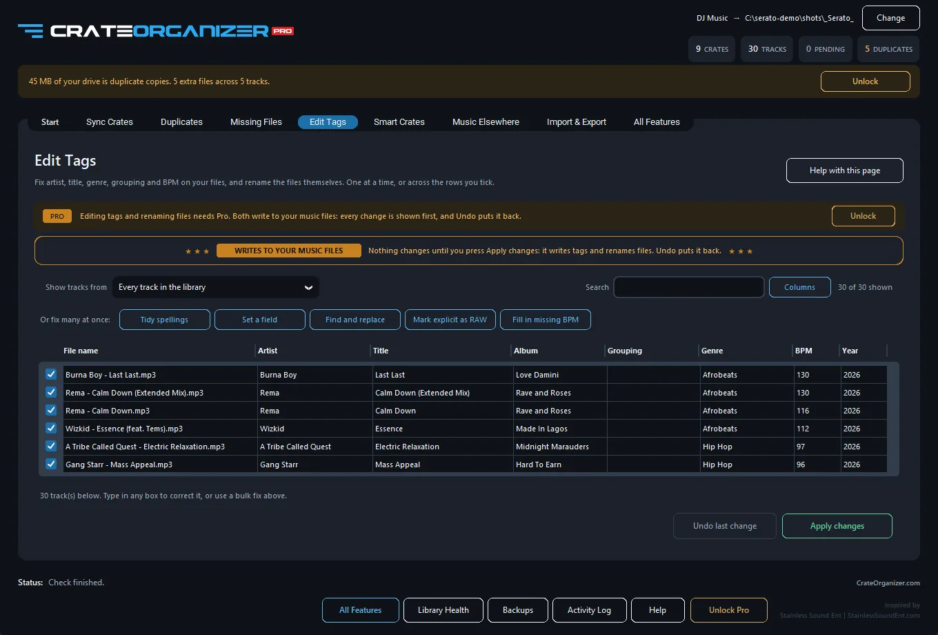 The edit tags table with one row per track and columns for file name, artist, title, album, grouping, genre, BPM and year
